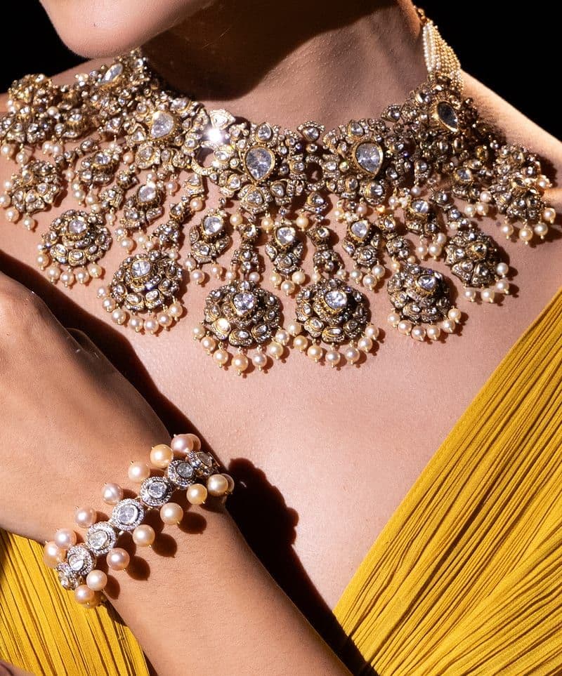 Close-up of a polki and pearl choker with a pearl bracelet