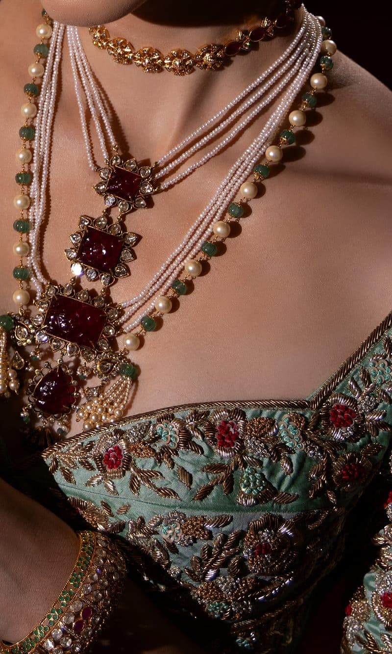 Zari embroidered blouse with pearl and ruby necklaces