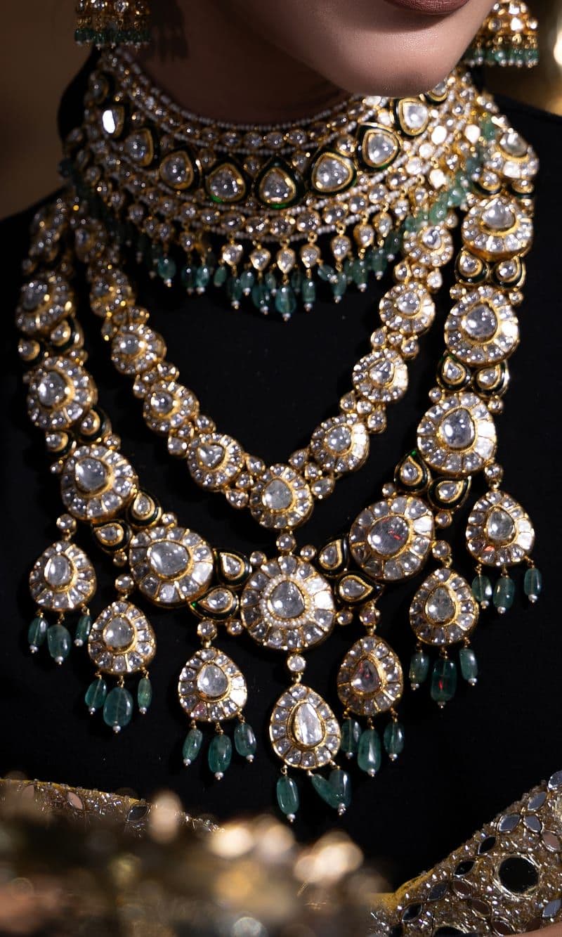 Layered polki necklaces with emerald drops